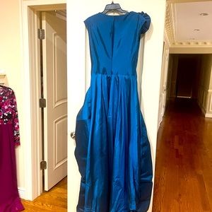 A custom-made blue gown. Size 6.
